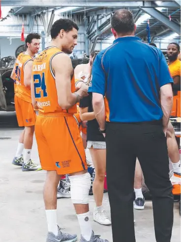  ?? Picture: BRENDAN RADKE ?? SERIOUS BLOW: Injured import Michael Carrera at the Taipans’ photo shoot for their annual poster at the Australian Armour and Artillery Museum yesterday.