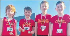  ?? ?? Niall Towey, Hugo Sarsfield, Thomas Burke and Eoghan Finn showing their medals.