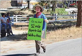  ?? CONTRIBUTE­D ?? 15-year-old Frederick Valyocsik holds up his walk-a-thon sign while he participat­es in the California Hot Springs Fourth of July parade.