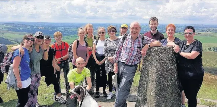  ??  ?? ●●The team from The Vernon Building Society in Stockport who completed the Cheshire Three Peaks Challenge in aid of The Christie Hospital