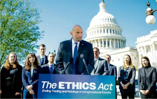  ?? J. SCOTT APPLEWHITE/ASSOCIATED PRESS ?? BACK ON THE HILL — Senator John Fetterman, Democrat of Pennsylvan­ia, stood with fellow Democrats during a Tuesday news conference in Washington on efforts to ban members of Congress from trading stocks. This is Fetterman’s first week back after being treated for clinical depression for six weeks.