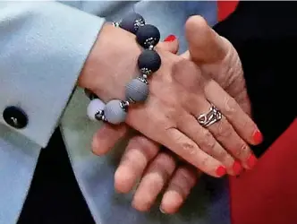  ??  ?? Hand in hand: Theresa May and Jean-Claude Juncker shake on the deal