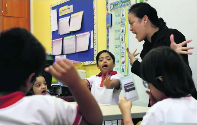  ?? Photos Ravindrana­th K / The National ?? Kismette Riguerra, a teacher in the Junior 1 English class, interacts with children at the Future Rehabilita­tion Centre at Mohammed bin Zayed City in Abu Dhabi.