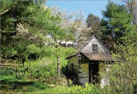  ?? PETE BANNAN — DAILY LOCAL NEWS ?? The spring house at Welkinweir looks out on the pond.