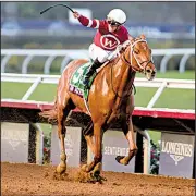  ?? AP/DENIS POROY ?? Florent Geroux rides Gun Runner to victory in the Classic race during the Breeders’ Cup on Saturday in Del Mar, Calif.