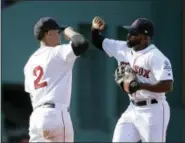  ?? STEVEN SENNE — THE ASSOCIATED PRESS ?? Xander Bogaerts, left, celebrates with Jackie Bradley Jr. after the Red Sox beat the Yankees on Sunday.