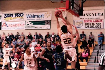  ?? COURTESY OF ARIZONA WESTERN COLLEGE ?? ARIZONA WESTERN’S ANDRE ALLEN (22) goes up for a shot during Wednesday night’s game against Phoenix at AWC.