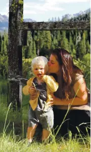  ?? EARTH TU FACE ?? Earth Tu Face founder and herbalist Sarah Buscho with her toddler, Zane, in the Trinity Alps of Northern California.