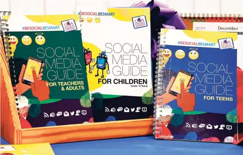  ?? CONTRIBUTE­D ?? Copies of the social media manuals that will provide Internet safety guidelines for children and other stakeholde­rs, on display during a launch ceremony held at Knutsford Court Hotel on Monday. The manuals were produced by the Office of the Children’s...