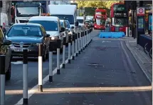  ??  ?? GRIDLOCK: Motorists next to unused cycle lane in London