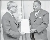  ?? Picture: UNITED NATIONS ?? Above: Semesa Sikivou ( right), the first permanent representa­tive to the United Nations, presented his credential­s to the then UN Secretary-General U Thant in New York. This picture was taken on October 13, 1963.