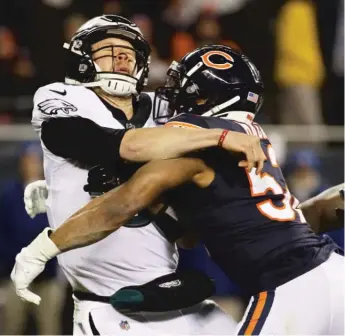 ?? JONATHAN DANIEL/GETTY IMAGES, MICHAEL PEREZ/AP (RIGHT) ?? Bears outside linebacker Khalil Mack faced quarterbac­k Nick Foles in an NFC wild-card game in January 2019 (above) and in a regular-season game in December 2017 (right).