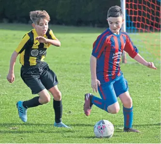  ??  ?? Dundee West Reds (red/blue) beat East Fife CFC 5-1 in an U/13 East Region Cup second-round clash at Charlotte Street.