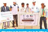  ??  ?? KRCS workers lay the foundation stone for the drilling of a water well and installati­on of a pump and pipes in Jufaina camp in Yemen.