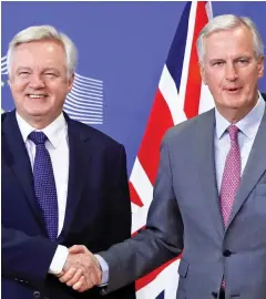  ??  ?? Tense: David Davis with EU negotiator Michel Barnier