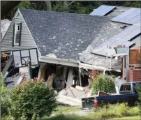  ?? Bloomberg photo by Scott Eisen ?? A home damaged by an explosion stands on Chickering Street in Lawrence, Mass. on Sept. 14, 2018.