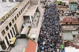  ?? Santiago Billy/Associated Press ?? Protesters pack the streets Thursday outside the attorney general’s office in Guatemala City after government interferen­ce in the nation’s presidenti­al election.