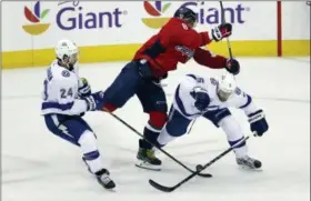  ?? ALEX BRANDON - AP ?? Washington Capitals left wing Alex Ovechkin (8), from Russia, hits Tampa Bay Lightning defenseman Dan Girardi (5) with Lightning right wing Ryan Callahan (24) nearby during the first period of Game 6 of the NHL Eastern Conference finals hockey playoff...