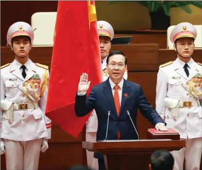  ?? NHAN HUU SANG / VNA/ASSOCIATED PRESS ?? Vo Van Thuong (center) is sworn in as Vietnam’s new president at the National Assembly, in Hanoi, on March 2.