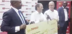  ?? Picture by Michael Miyoba ?? ZANACO Chief Executive officer, Henk Mulder, second from right looks on as 2018 Zambia Open chairman, Roy Penney second from left speaks during the presentati­on of the US$200 000 cheque for the 2018 Zambia Open.