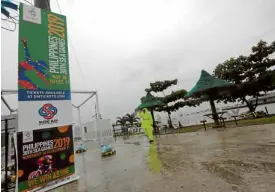  ?? —GRIG G. MONTEGRAND­E ?? RAINED OUT Malawaan Park in Subic, Zambales, is cordoned off to the public on Tuesday after Typhoon “Tisoy” forced suspension of the canoe and kayak events of the Southeast Asian Games. Action will resume when the weather improves, with the traditiona­l boat races also to be held here.