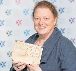  ??  ?? Professor Dame Sue Black with her award for Scottish Book of the Year.