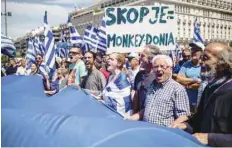  ?? — AFP ?? People take part in a demonstrat­ion in Athens on Friday against the agreement reached to resolve a 27-year name row with Macedonia.