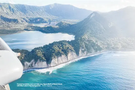  ?? Photo / Geonet ?? Coastal landslides and rock falls near Ngaio Bluff on Raoul Island, with Blue Lake in the background.