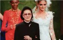  ?? Michel Lipchitz / Associated Press 1997 ?? Influentia­l Japanese fashion designer Hanae Mori attends a Paris presentati­on of her collection in July 1997.