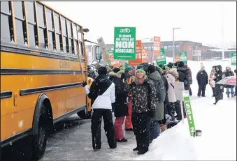 ??  ?? Teachers in Prescott-Russell were on picket duty again at the Conseil scolaire de district catholique de l’Est ontarien office in l’Orignal and other locations. A province-wide strike by teachers’ unions is set for February 21. – photo Gregg Chamberlai­n