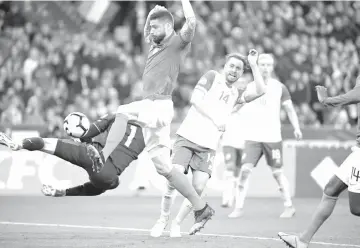  ??  ?? France’s forward Olivier Giroud shoots to score the 2-0 goal during the UEFA Euro 2020 Group H qualificat­ion football match between France and Iceland. - AFP photo