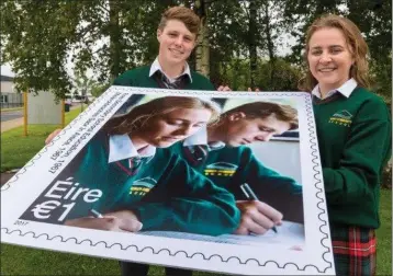  ??  ?? Lauren Dench and Michael Duke, pupils of Gorey Community School who feature on a stamp.