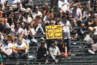  ?? Scott Strazzante / The Chronicle ?? Giants fans greeted Kris Bryant warmly for his first home game at Oracle Park on Sunday.