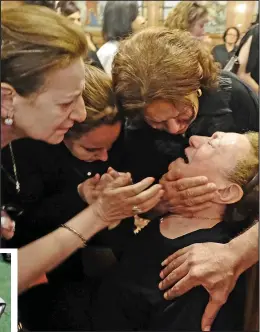  ??  ?? Grief: Family at a Cairo memorial for air hostess Yara Hani Tawfik comfort her grandmothe­r. Left: Debris from the jet