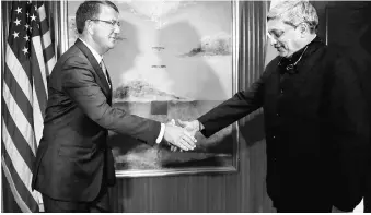  ?? REUTERS FILE PHOTO ?? US Secretary of Defense Ash Carter meets India’s Defence Minister Manohar (left) Parrikar for a bilateral at the IISS Shangri-La Dialogue in Singapore in June 2016