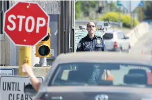  ?? ELAINE THOMPSON THE ASSOCIATED PRESS FILE PHOTO ?? A policy prohibitin­g Canadians legally employed in the domestic cannabis industry from entering the United States has been updated just days before legalizati­on in Canada.