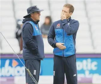  ??  ?? England’s Eoin Morgan (right) and head coach Trevor Bayliss deep in discussion.