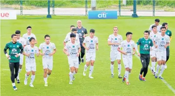  ??  ?? Thai players train at Kiarti Thanee Country Club yesterday ahead of the King’s Cup.