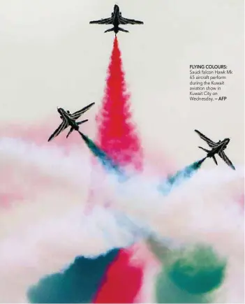  ?? FLYING COLOURS: — AFP ?? Saudi falcon Hawk Mk 65 aircraft perform during the Kuwait aviation show in Kuwait City on Wednesday.