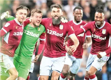  ?? Photograph: Nick Potts/PA ?? Goalkeeper Jed Steer celebrates with his Aston Villa teammates after saving two penalties in the crucial shootout.