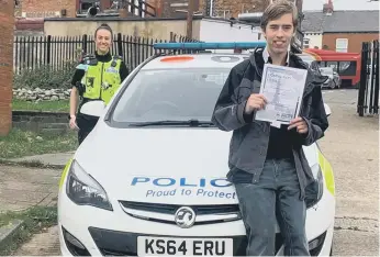  ??  ?? PC Louise Noble presents Max with his certificat­e.