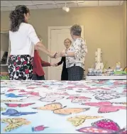  ??  ?? Lisa Kiely (front left), director of enrichment for Lenbrook, spontaneou­sly dances with residents (from left) Marlene Puca, Ortrude White and Jacque Durrant, who also leads many art projects at Lenbrook. The residents were painting butterflie­s and...