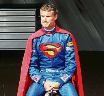  ?? — AFP ?? Caped crusader: Red Bull driver David Coulthard wearing a Superman costume during the 2006 Monaco Grand Prix.