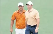  ?? REUTERS ?? Rory McIlroy, right, and Brooks Koepka at the Masters in April.