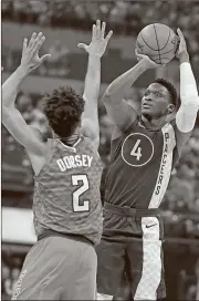  ?? Michael Conroy / AP ?? Indiana’s Victor Oladipo (right) shoots over Atlanta’s Tyler Dorsey during the first half of Friday’s game in Indianapol­is.