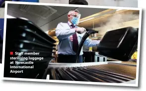  ??  ?? ■ Staff member sterilisin­g luggage at Newcastle Internatio­nal Airport