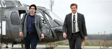  ?? Ben Rothstein/Warner Bros. Entertainm­ent via AP ?? Adam Driver, left, is a sensitive NSA agent pursuing an 8-year-old boy with a special power.
