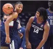  ?? Jessica Hill / Associated Press ?? UConn’ Rahsool Diggins, left, and Corey Floyd, Jr., right, have a playful moment during First Night events for the UConn men’s and women’s basketball teams on Friday.