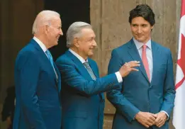  ?? ANDREW HARNIK/AP ?? President Joe Biden, left, Mexican President Andres Manuel Lopez Obrador and Canadian Prime Minister Justin Trudeau meet Tuesday at a summit in Mexico City.