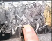  ??  ?? Rion Causey points to himself in a platoon photograph from 1967. The former medic will be featured in Ken Burns’ 10part, 18-hour documentar­y on the Vietnam War.